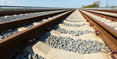 Concrete railway sleepers arranged in rows for transport